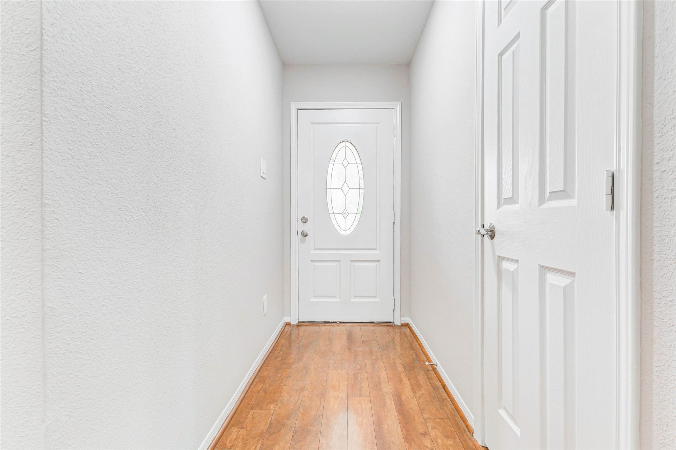 2410 Clear Ridge Drive Houston, TX 77339 - Photo 5 of 24 a view of a livingroom with wooden floor and a window