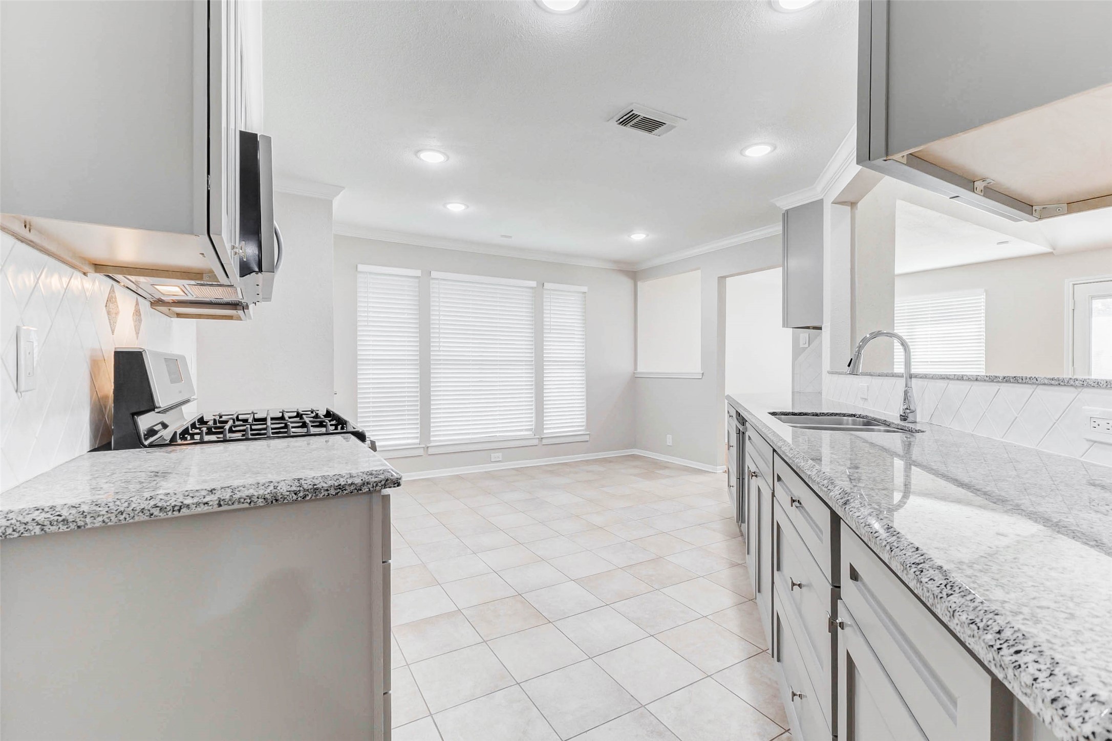 2410 Clear Ridge Drive Houston, TX 77339 - Photo 6 of 24 a kitchen with a sink stove and cabinets