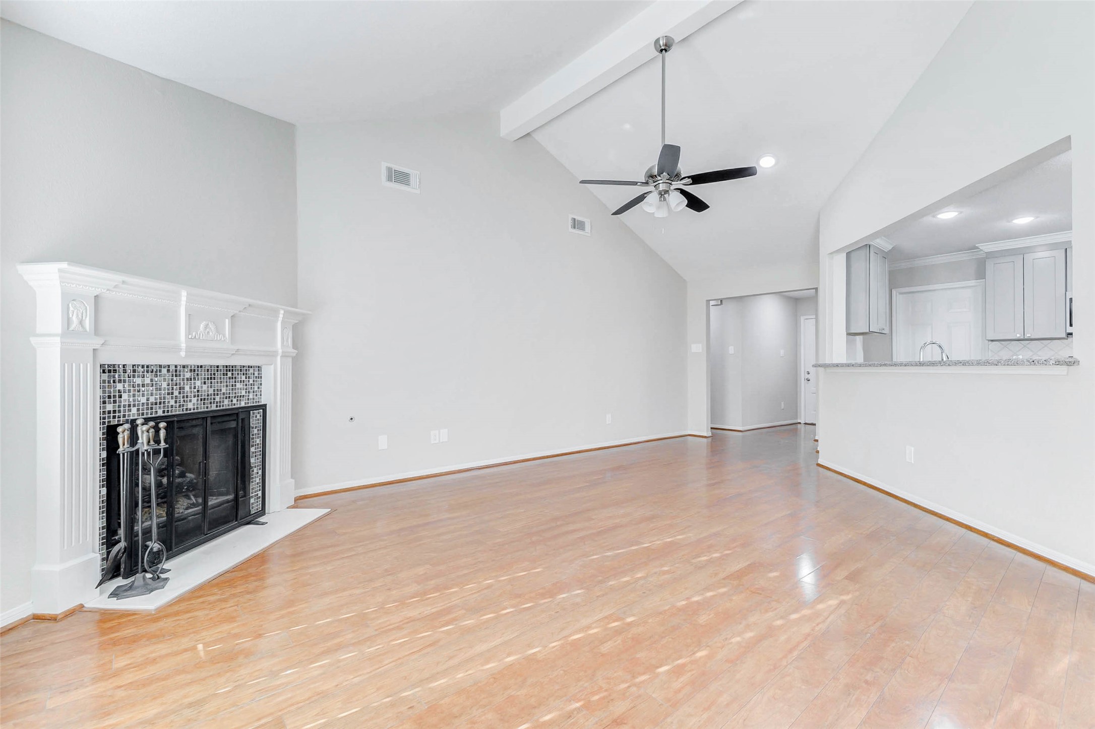 2410 Clear Ridge Drive Houston, TX 77339 - Photo 9 of 24 a view of empty room with fireplace and a ceiling fan