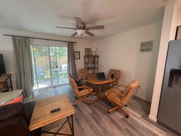 a workspace with wooden floor and a window