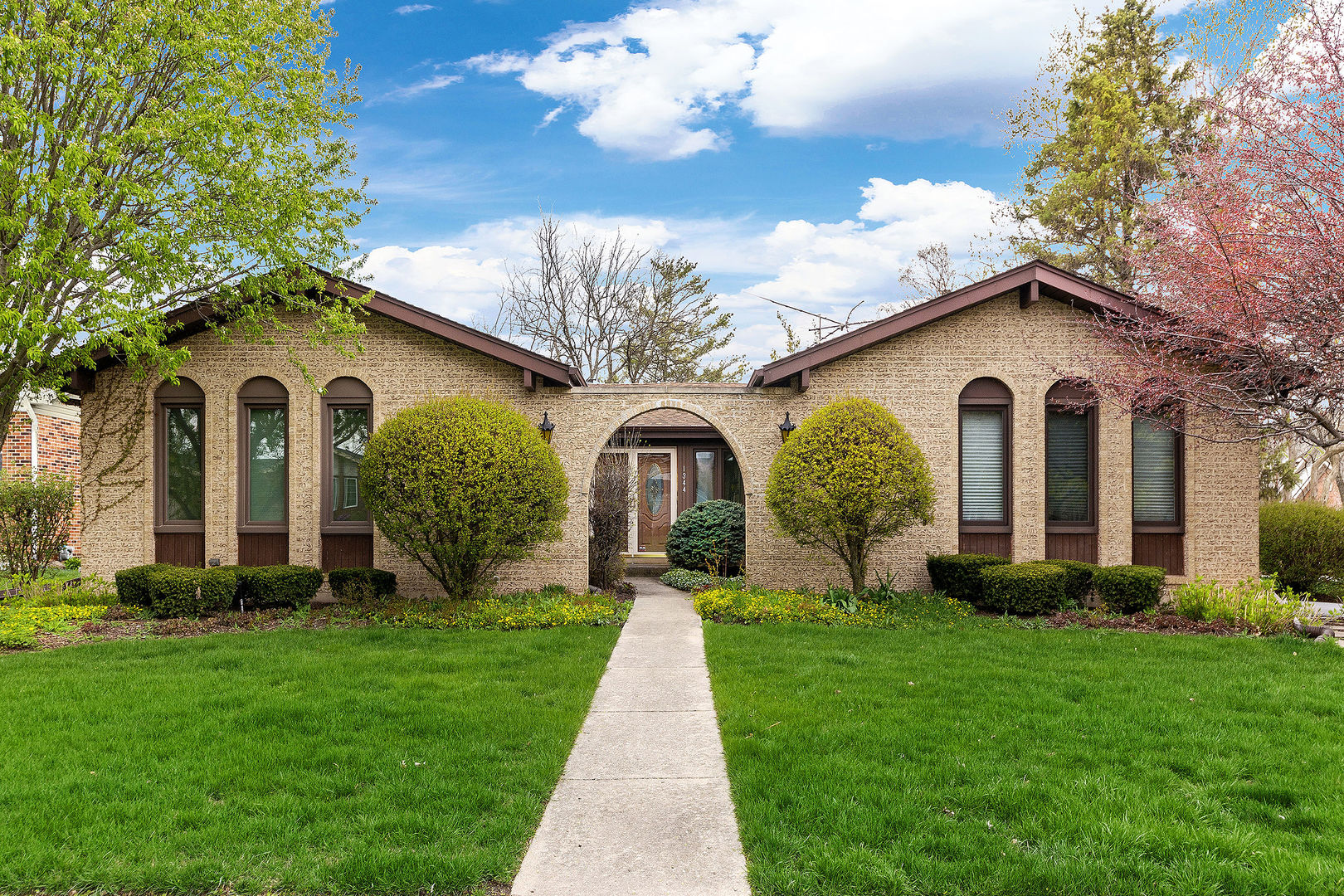 a front view of a house with a yard