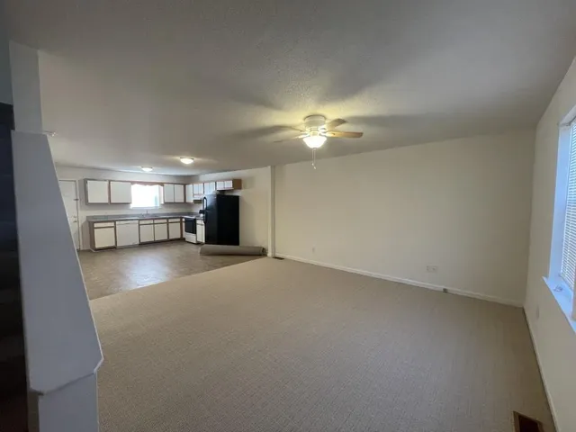 a view of a livingroom with furniture and a chandelier