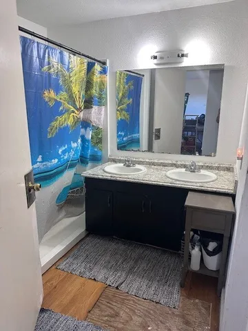 a bathroom with a sink a vanity and a mirror
