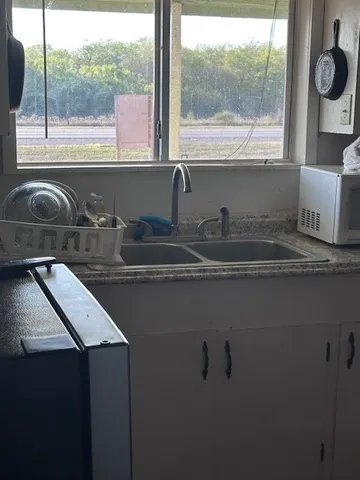a kitchen with a sink and a window