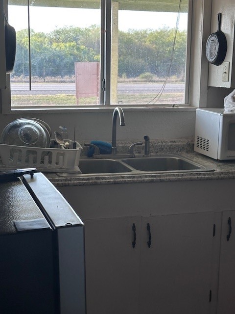 5452 Fm 666 Street Mathis, TX 78368 - Photo 4 of 17 a kitchen with a sink and a window