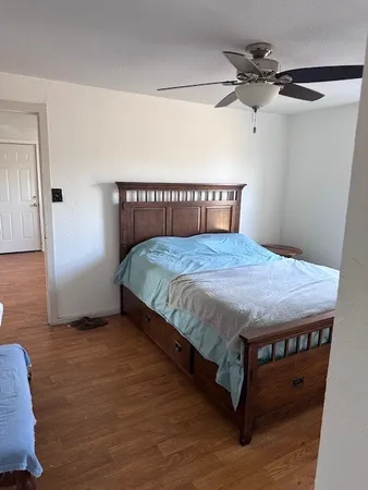 a bedroom with a bed and a dresser