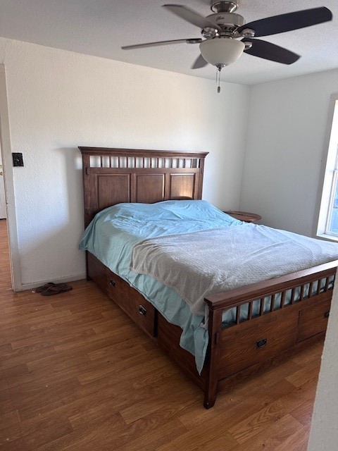 5452 Fm 666 Street Mathis, TX 78368 - Photo 10 of 17 a bed sitting in a bedroom next to a window