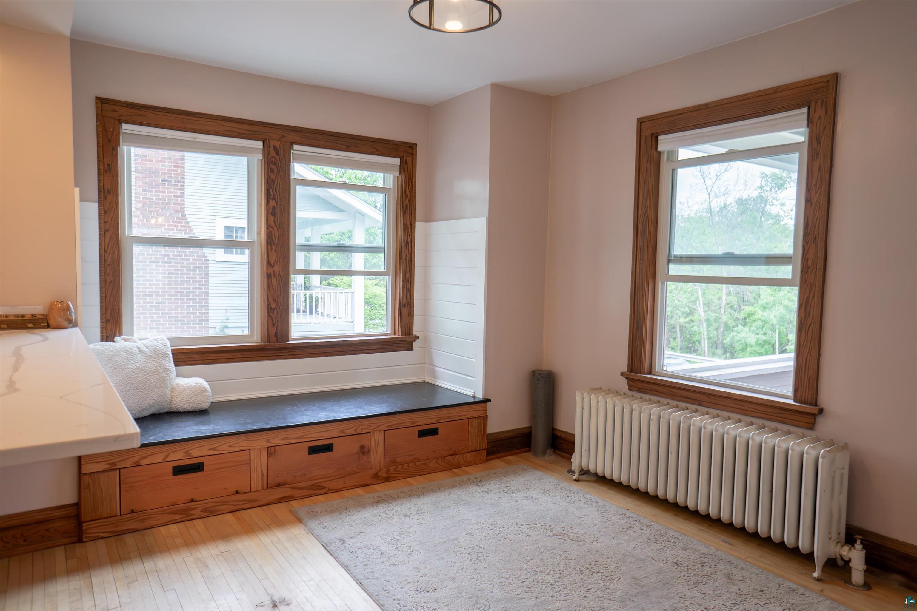 201 Snively Road Duluth, MN 55803 - Photo 6 of 21 Interior space featuring radiator and light hardwood / wood-style flooring