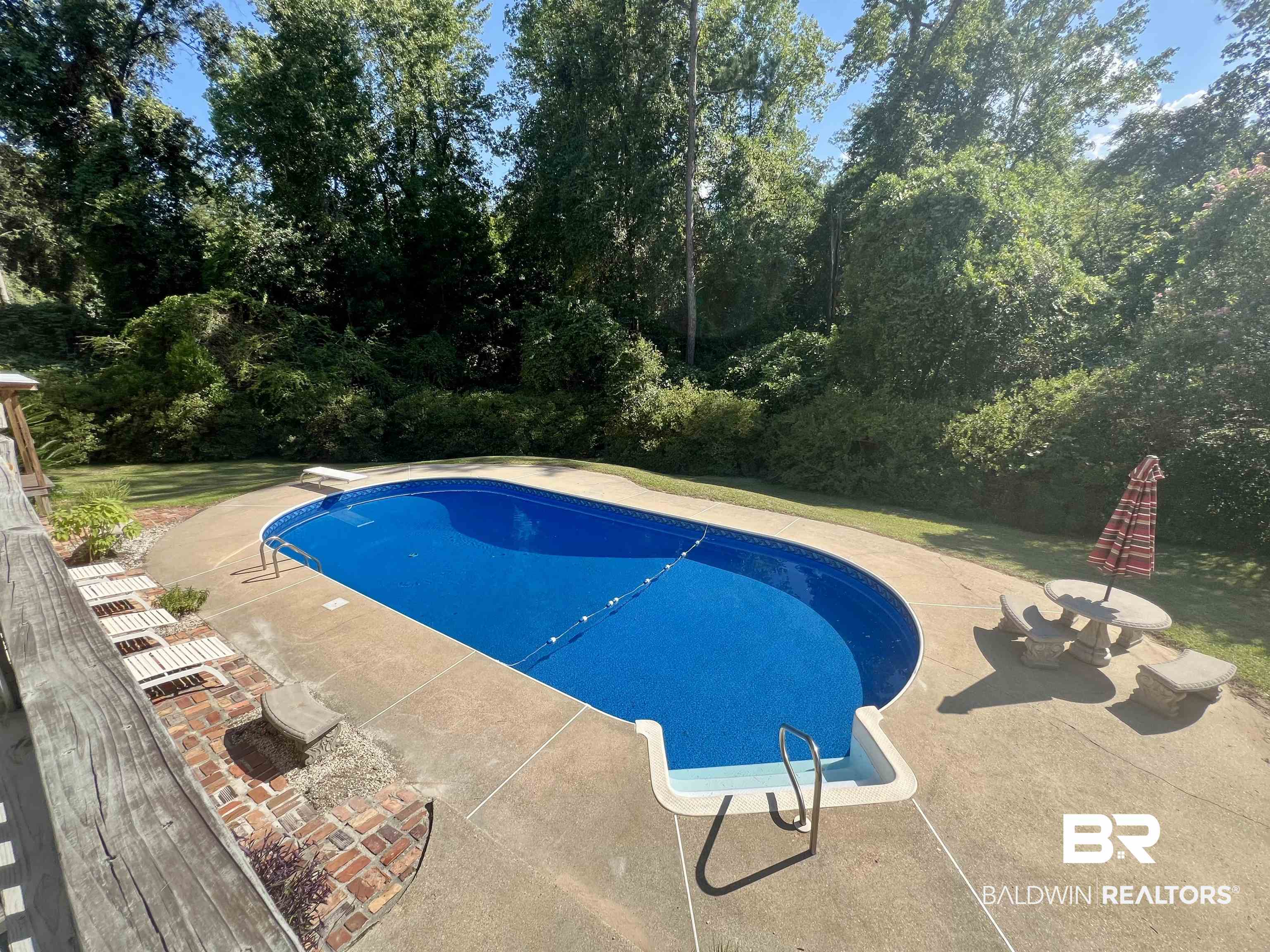 2691 Appleton Road Brewton, AL 36426 - Photo 44 of 60 Outdoor pool featuring a patio area and a diving board