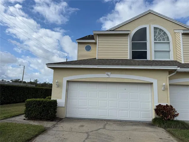 a front view of a house with a garage