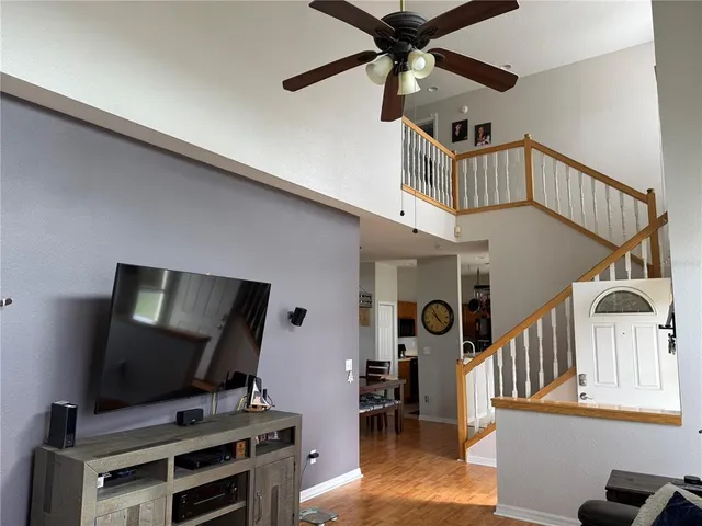 a living room with furniture and flat screen tv