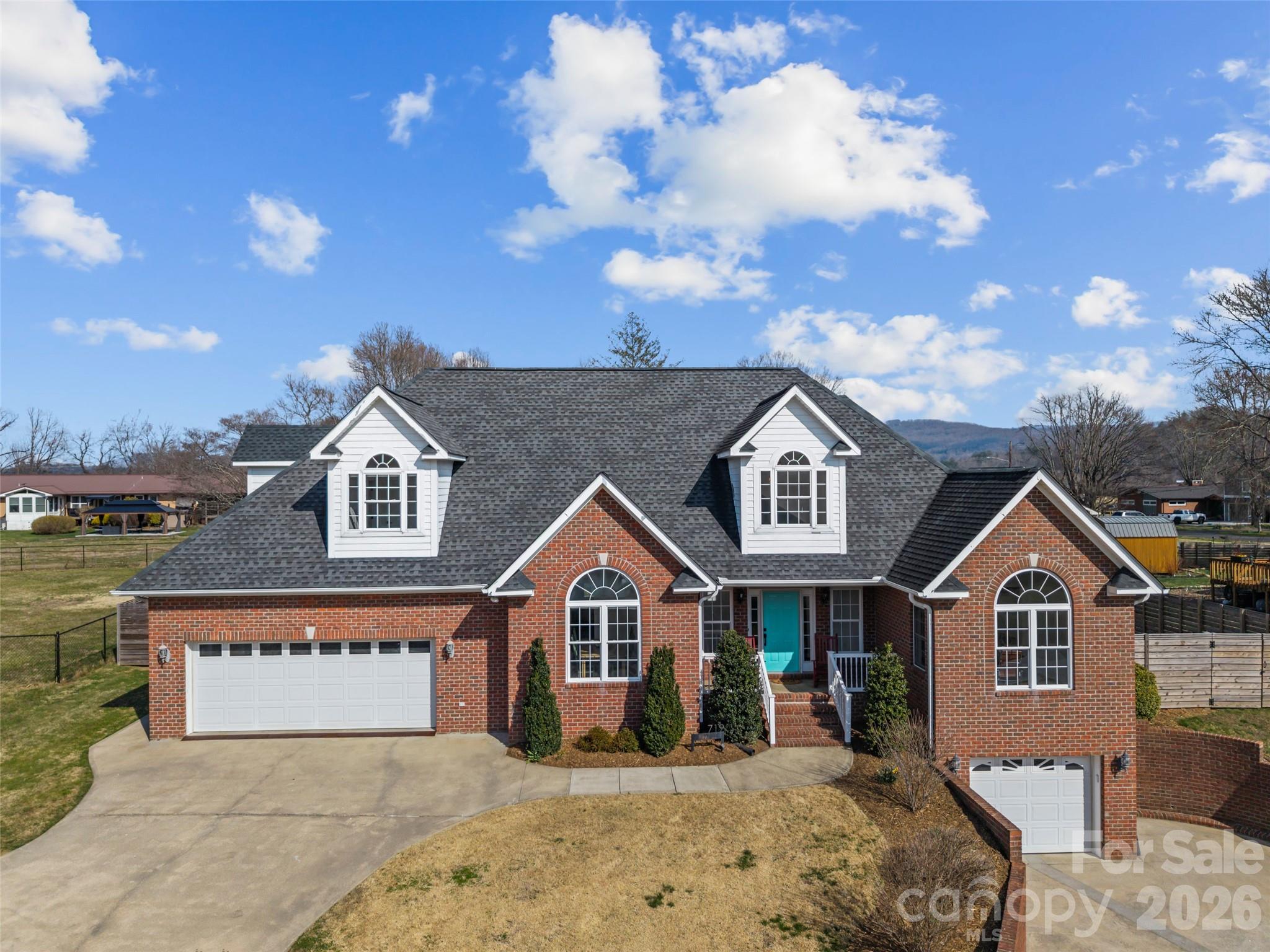 719 Neely Road Brevard, NC 28712 - Photo 1 of 33 a front view of a house with a yard