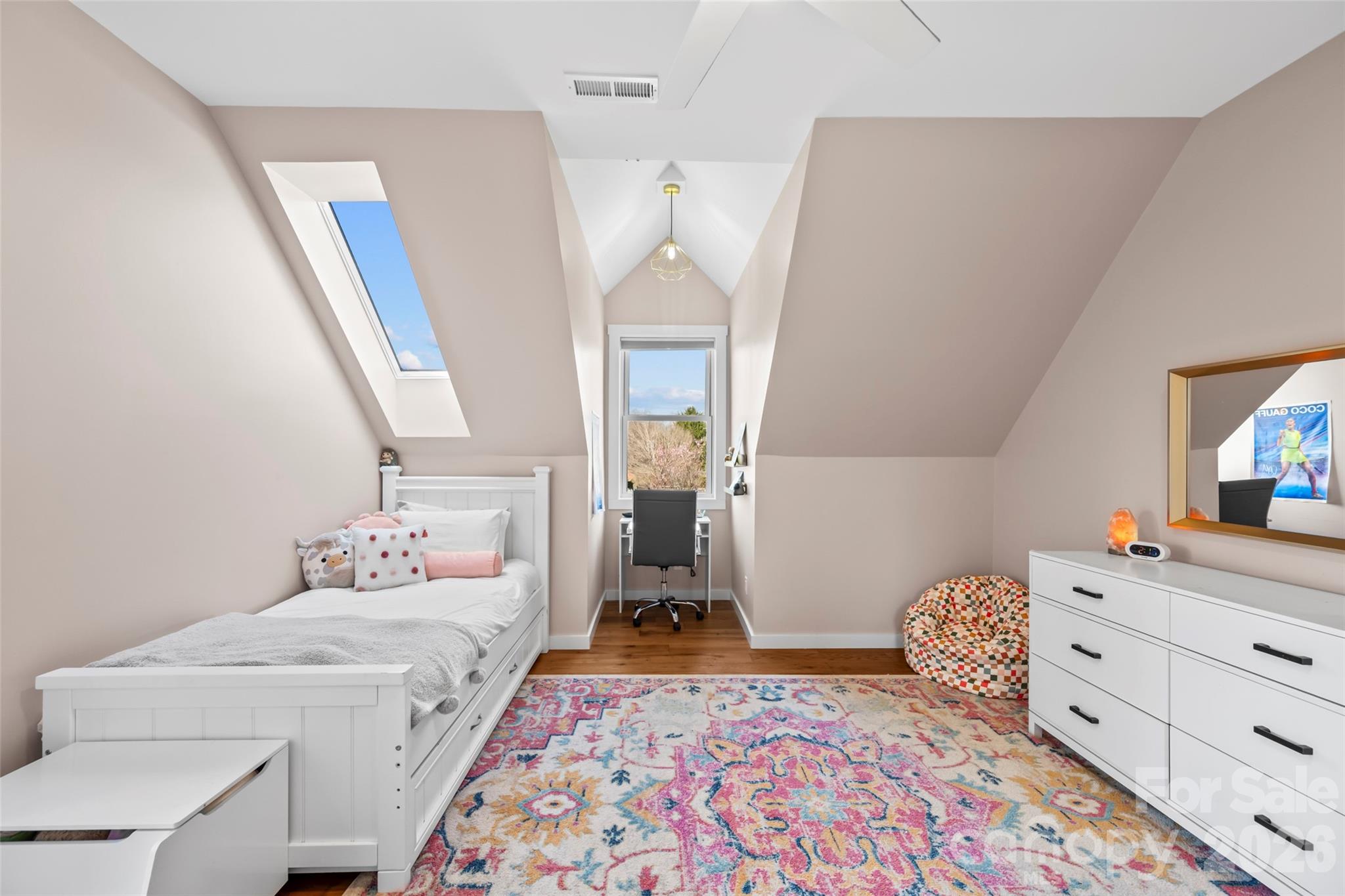 719 Neely Road Brevard, NC 28712 - Photo 18 of 33 a bedroom with a bed and wooden floor