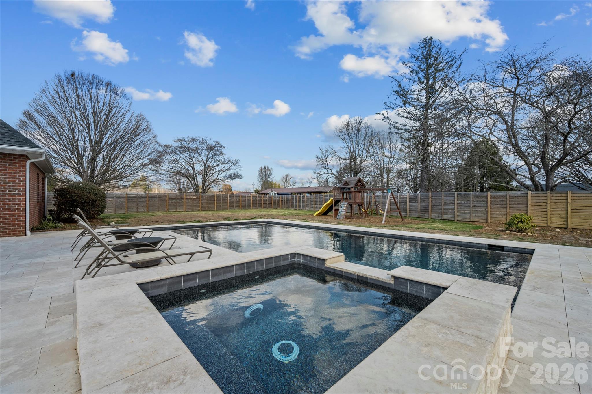 719 Neely Road Brevard, NC 28712 - Photo 27 of 33 a view of a swimming pool with a lounge chairs