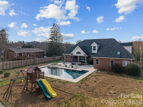 an aerial view of residential houses with outdoor space