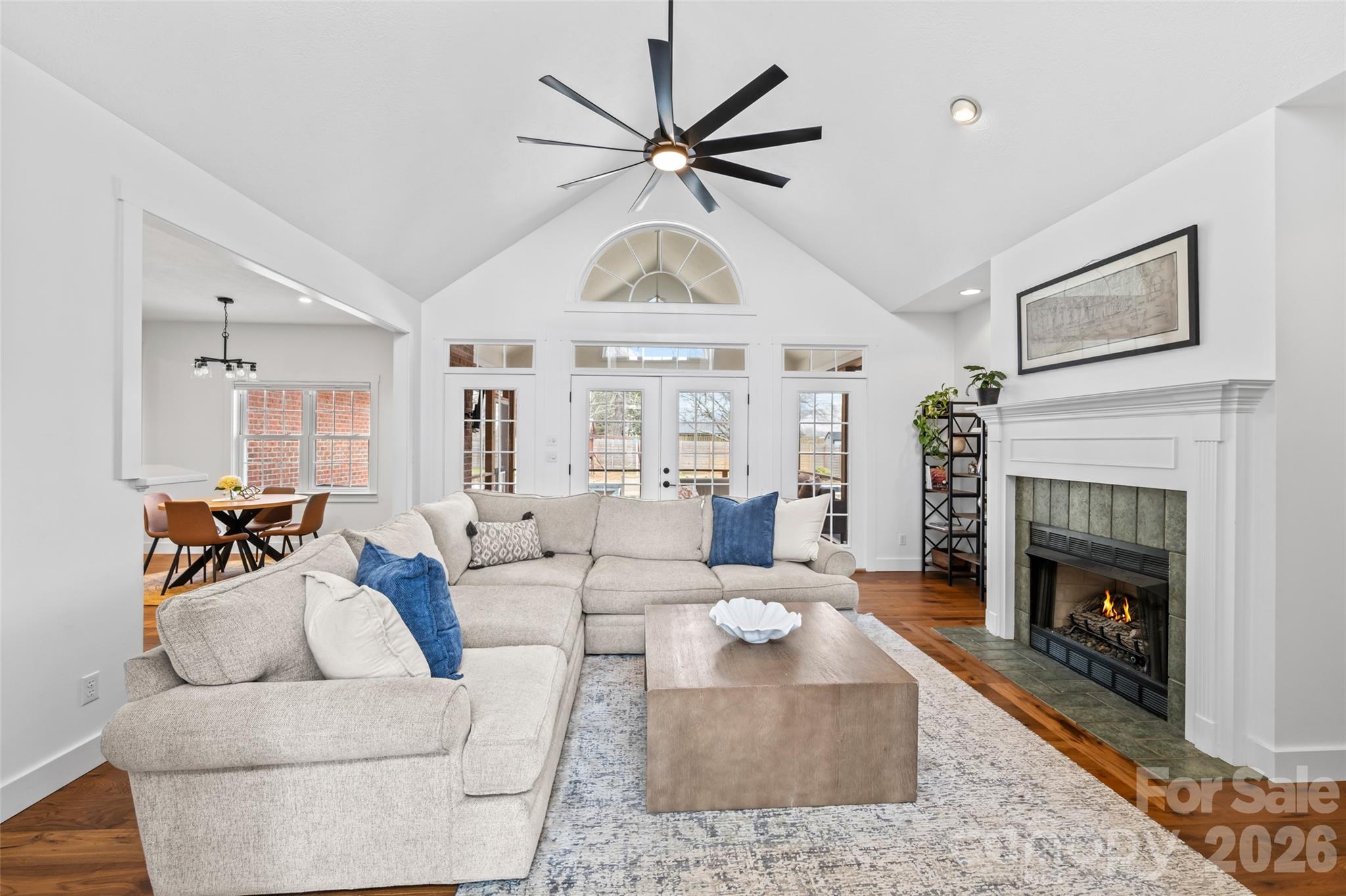 719 Neely Road Brevard, NC 28712 - Photo 4 of 33 a living room with furniture a clock and a fireplace