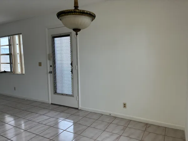 a view of an entryway with a chandelier