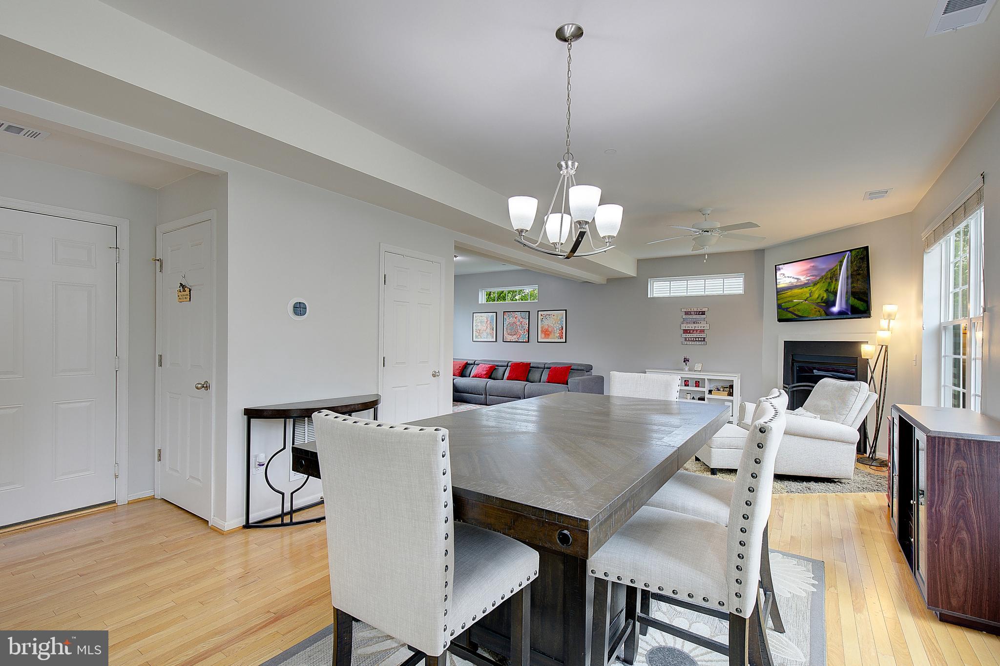403 Venton Road Edgewater, MD 21037 - Photo 17 of 62 a view of a dining room with furniture wooden floor and chandelier