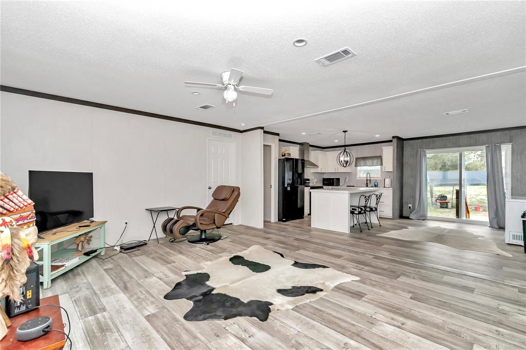 5190 Southwest 178th Terrace Dunnellon, FL 34432 - Photo 15 of 51 a living room with furniture and a flat screen tv