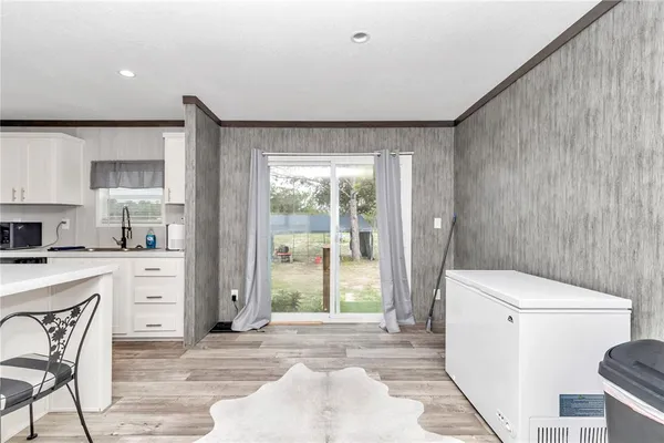 a kitchen that has a stove a sink and a refrigerator