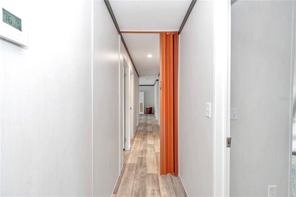 5190 Southwest 178th Terrace Dunnellon, FL 34432 - Photo 24 of 51 a view of a hallway with wooden floor
