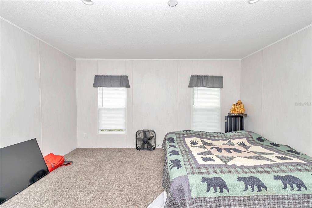 5190 Southwest 178th Terrace Dunnellon, FL 34432 - Photo 43 of 51 a bedroom with a bed and window