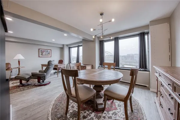 a view of a dining room with furniture window and outside view