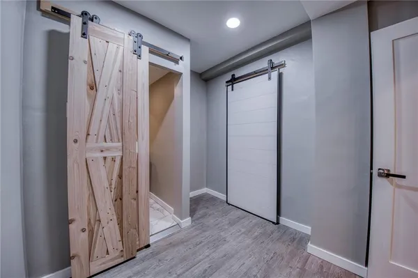 a view of walk in closet with wooden floor