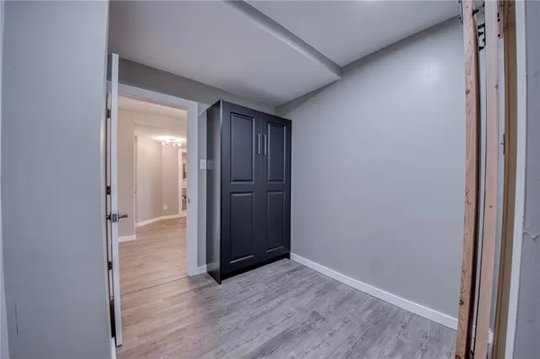 an empty room with wooden floor