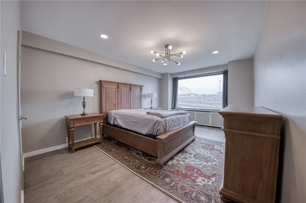 a bedroom with a bed and window