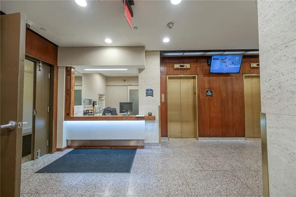 a view of gallery with wooden floor