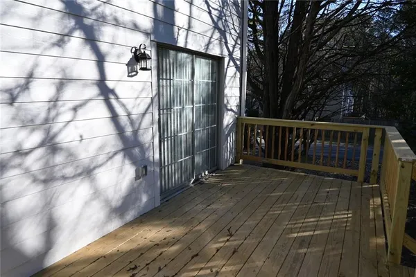 a view of wooden deck with a trees