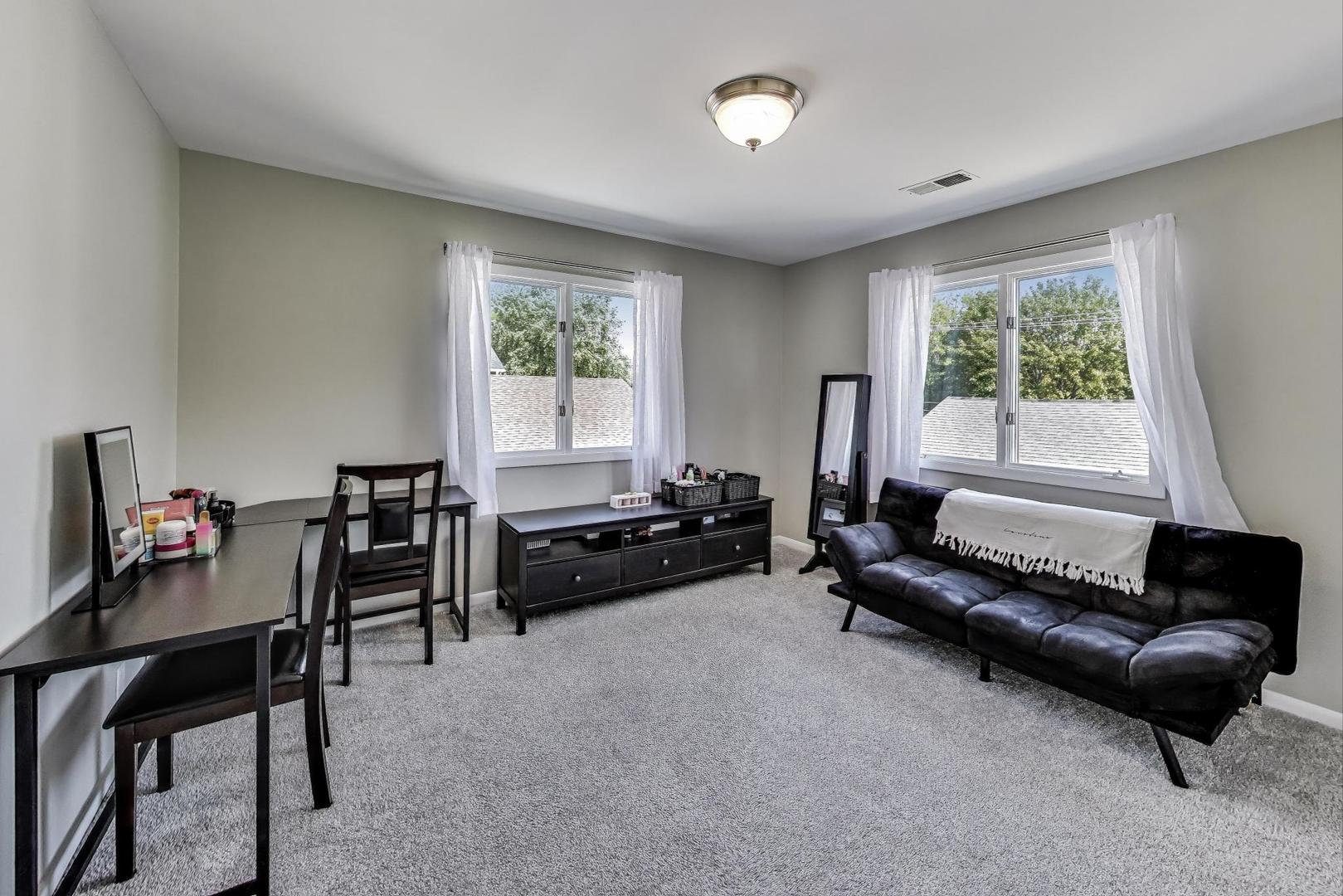 3600 Owl Drive Rolling Meadows, IL 60008 - Photo 11 of 21 a living room with furniture and a window