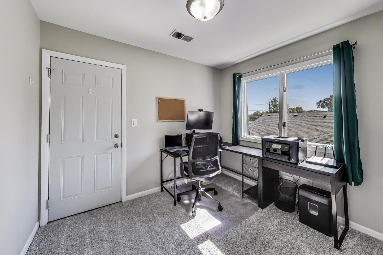 3600 Owl Drive Rolling Meadows, IL 60008 - Photo 12 of 21 a view of a workspace with furniture and a window