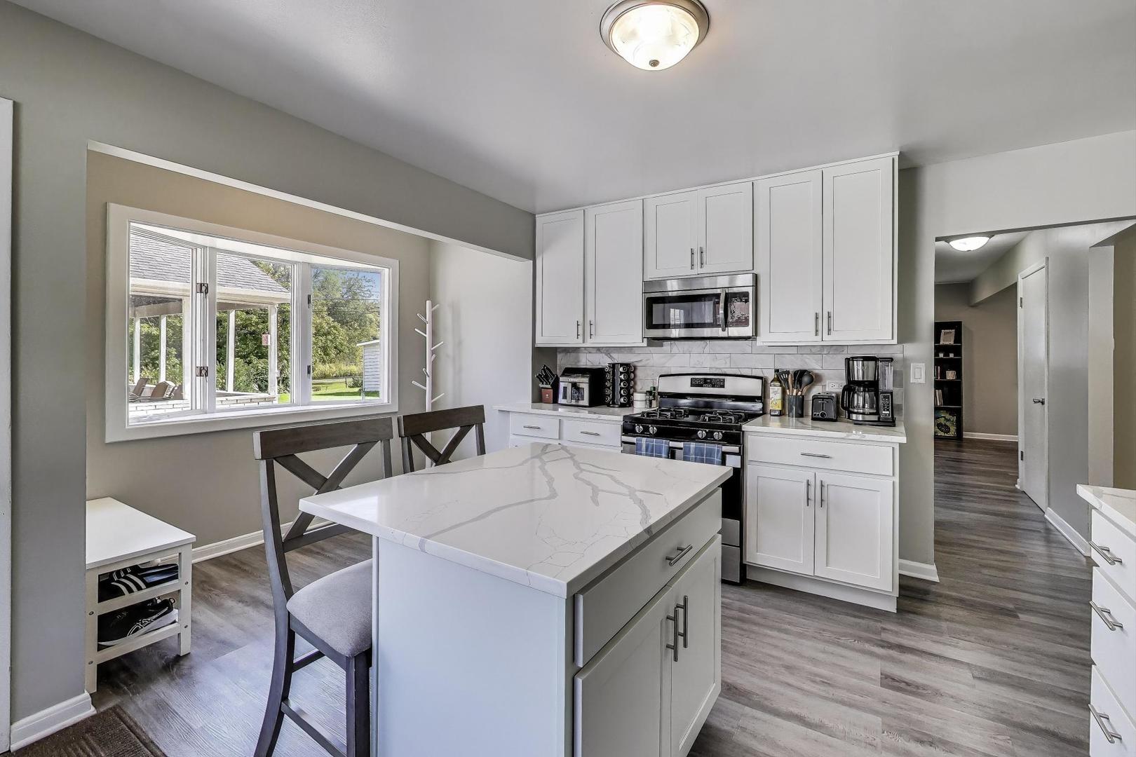 3600 Owl Drive Rolling Meadows, IL 60008 - Photo 5 of 21 a kitchen with a stove a sink and a refrigerator
