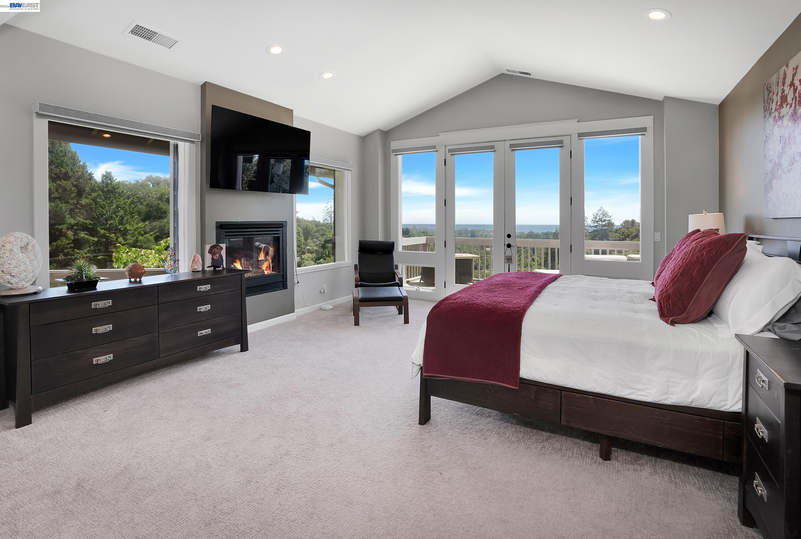 905 Moon Valley Ranch Road Watsonville, CA 95076 - Photo 32 of 60 a spacious bedroom with a bed and a fireplace