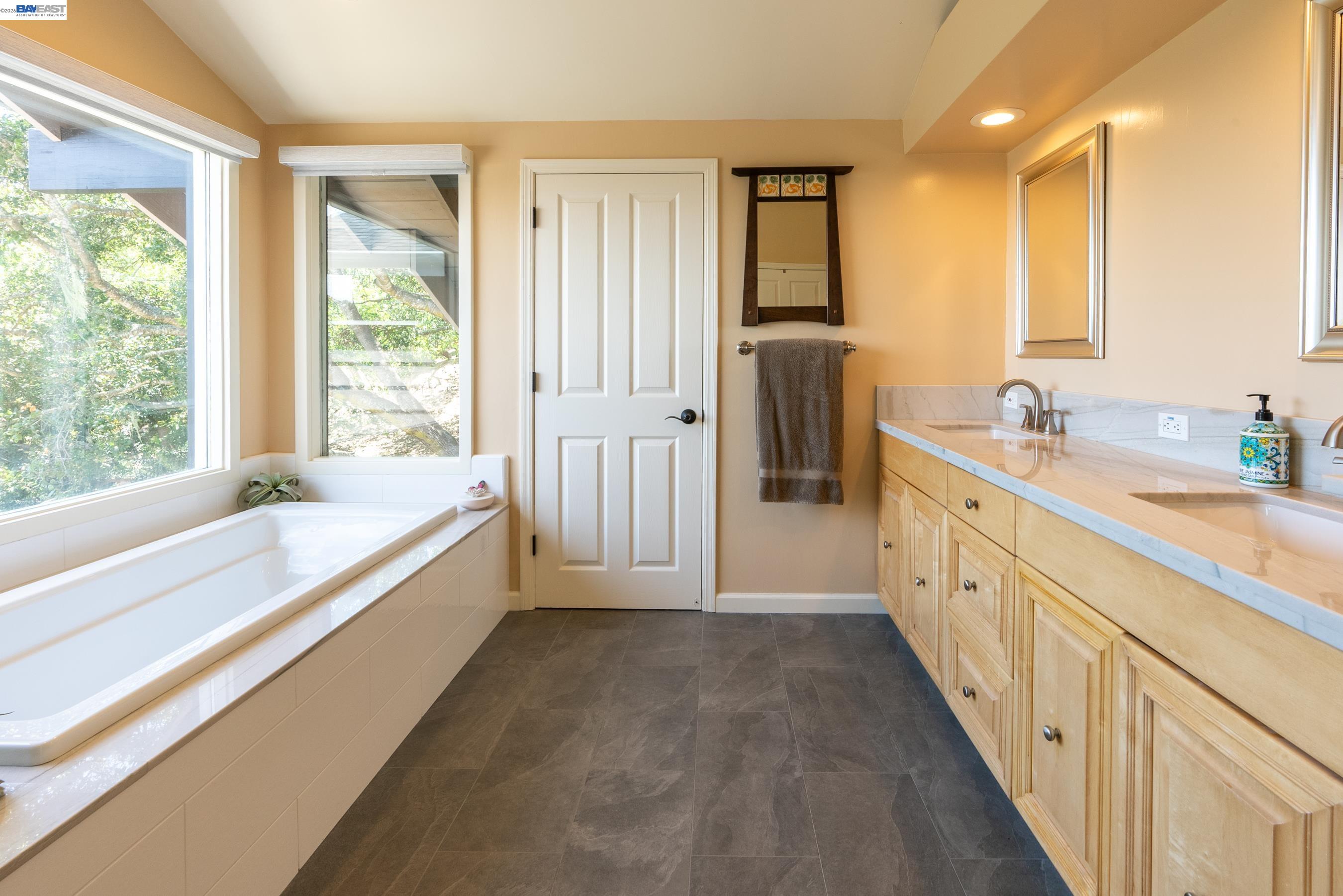 905 Moon Valley Ranch Road Watsonville, CA 95076 - Photo 35 of 60 a spacious bathroom with a tub sink and mirror