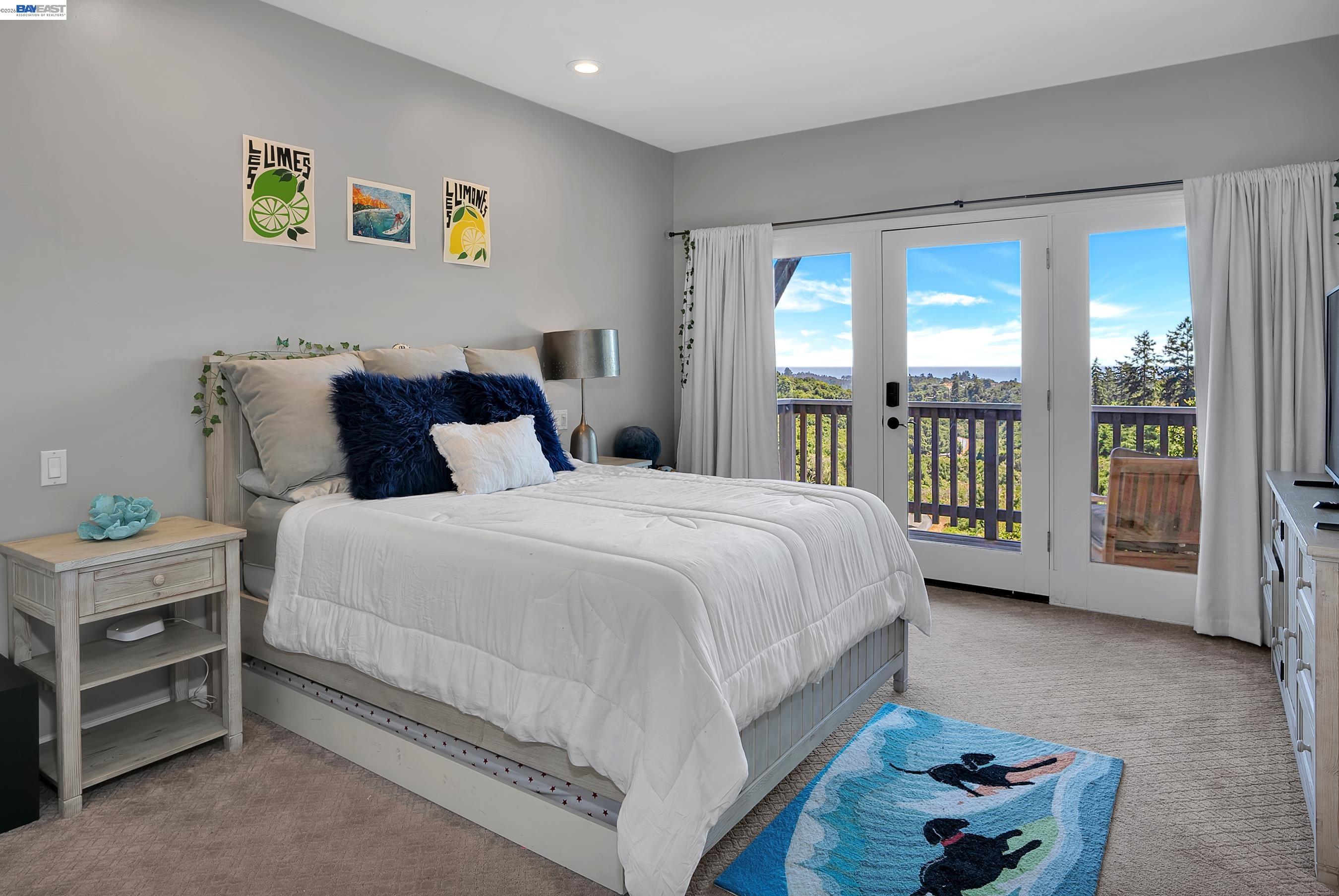 905 Moon Valley Ranch Road Watsonville, CA 95076 - Photo 41 of 60 a spacious bedroom with a bed and a large window