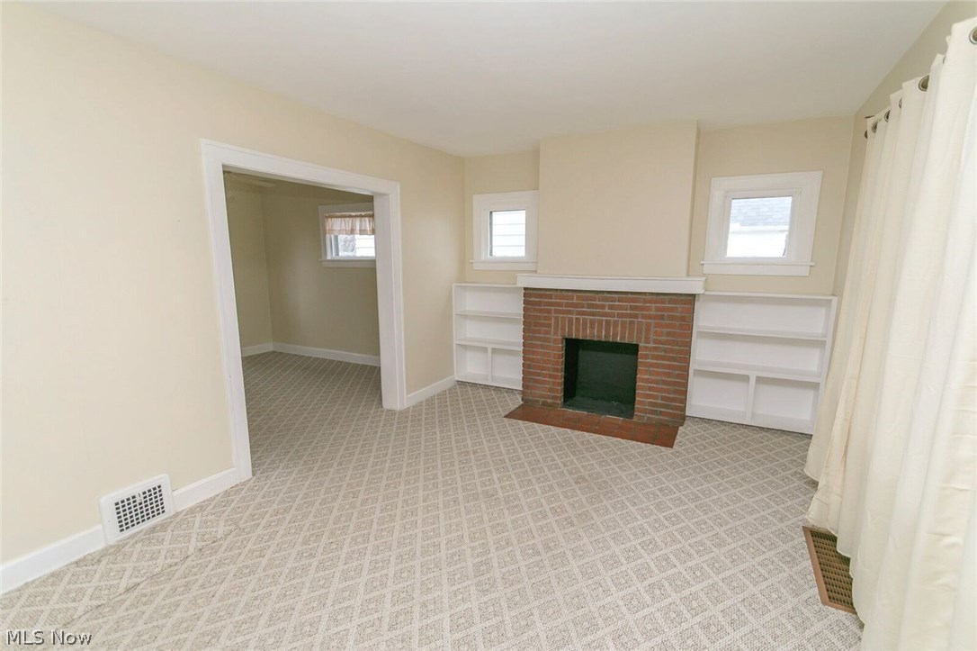 12909 Littleton Road Garfield Heights, OH 44125 - Photo 5 of 24 Cool and clean neutral colors now add your finishing touches to this spacious living room.