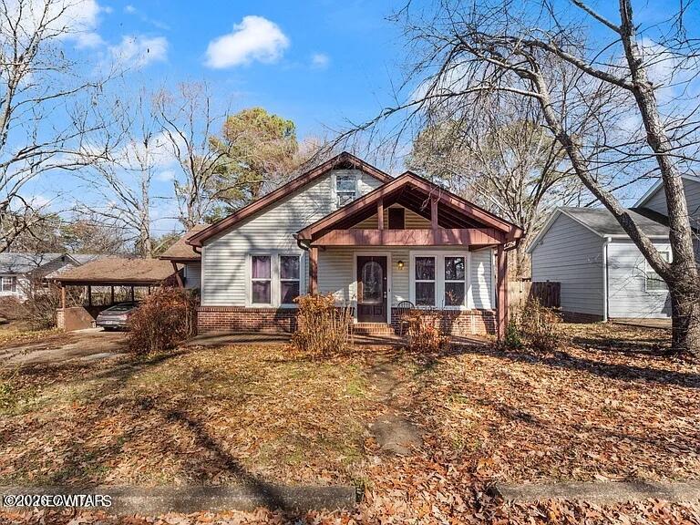 218 Marshall Street Martin, TN 38237 - Photo 1 of 1 a front view of a house with garden