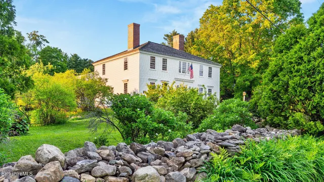 a wooden bench sitting in a yard