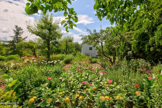 a very nice looking living room with a large window and kitchen view