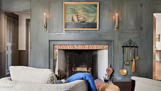 a living room filled with furniture and a large window