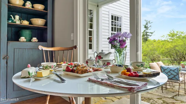 a view of a livingroom with furniture and a window