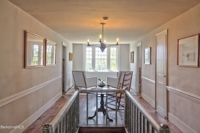 a living room with furniture a rug and a window