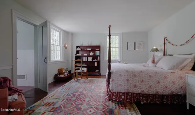a view of a chair and table in the garden