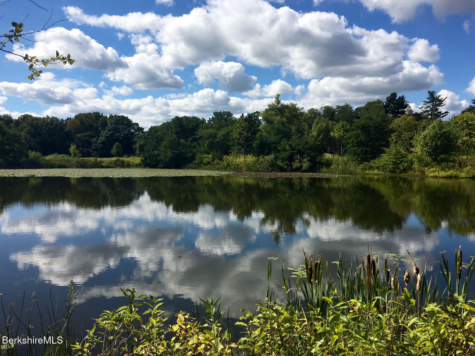 764 East Hill Road New Marlborough, MA 01259 - Photo 6 of 82 a view of a lake with a city