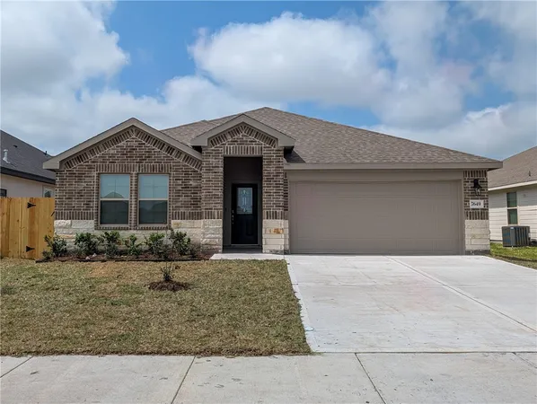 a front view of a house with yard