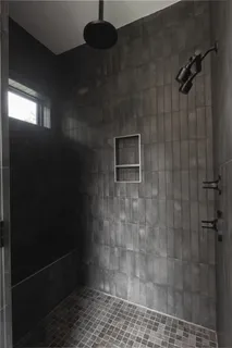 a white tub sitting next to a white sink