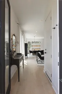 a dining room with furniture and a chandelier